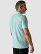 Model in full body weraing a Piquet Polo Shirt Aqua Blue