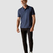 Model in full body weraing a Piquet Polo Shirt Navy