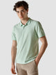 Model wearing a Piquet Polo Shirt Seagrass green