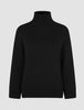 Women Chunky Soft Wool Knit Turtleneck Black chunky knit sweater featuring long sleeves and ribbed cuffs and hem.