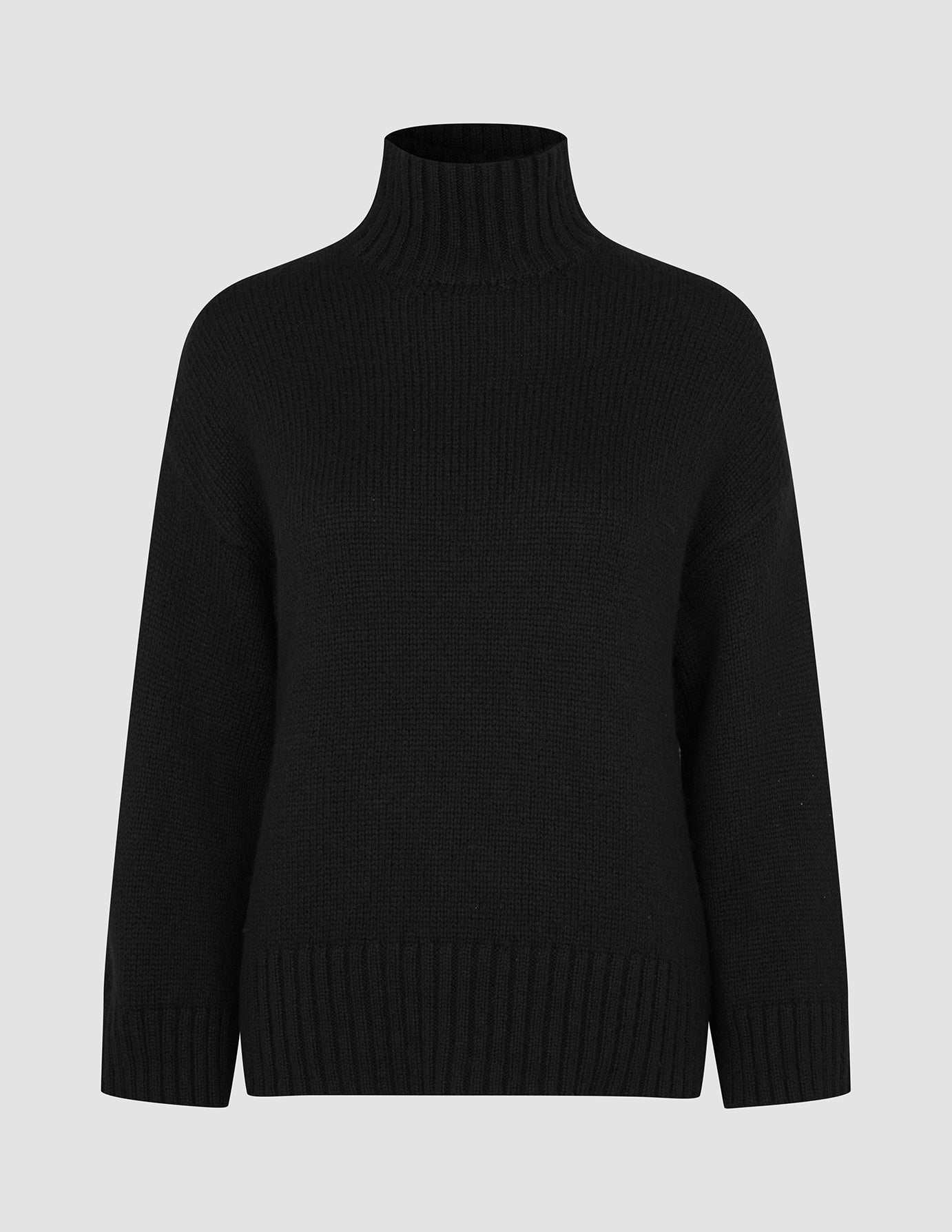 Women Chunky Soft Wool Knit Turtleneck Black chunky knit sweater featuring long sleeves and ribbed cuffs and hem.
