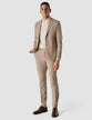 Model in full body wearing a Sand Grain Blazer with a shirt and matching suit pants