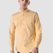 Model from the front wearing a Classic Shirt brick yellow