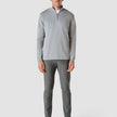 Model in full body wearing grey stone half zip in fine knit with a white t-shirt underneath