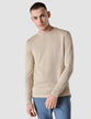 Model seen from the front wearing a Sand Grain Molinaire fine knit crewneck