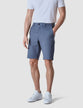 Model seen from the front wearing Classic Shorts Blue mirage shorts with a white t-shirt