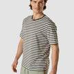 Model wearing a urban green striped box fit t-shirt