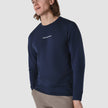 Model from the front wearing a navy blue long sleeved t-shirt 