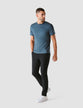 Model in full body weraing Cobalt Blue t-shirt with black pants and white sneakers