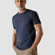 Model wearing navy t-shirt seen from the front
