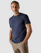 Model wearing navy t-shirt seen from the front