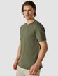 Model wearing urban green t-shirt seen from the front