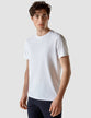 Model wearing white t-shirt seen from the front