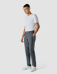 Model in full body wearing a pair of Tech Linen Elastic Pants Navy