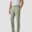 Model from the front wearing a pair of Tech Linen Elastic Pants Neutral Green