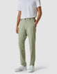Model from the front wearing a pair of Tech Linen Elastic Pants Neutral Green