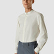 Model from the front wearing a Tech Linen Mandarin Long Sleeve Shirt White