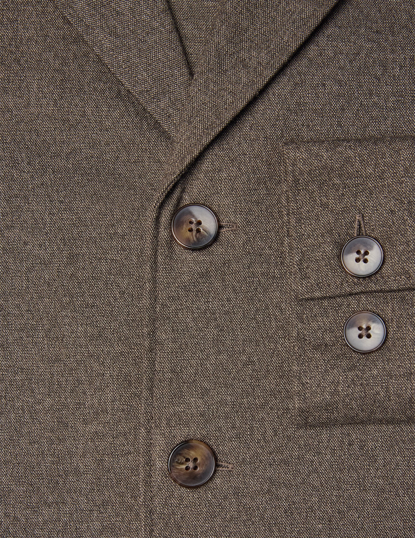 Close-up of an Atelier Overshirt Dark Beige in heavyweight twill, featuring dark horn-style buttons, a breast pocket, and a clean Scandinavian design.