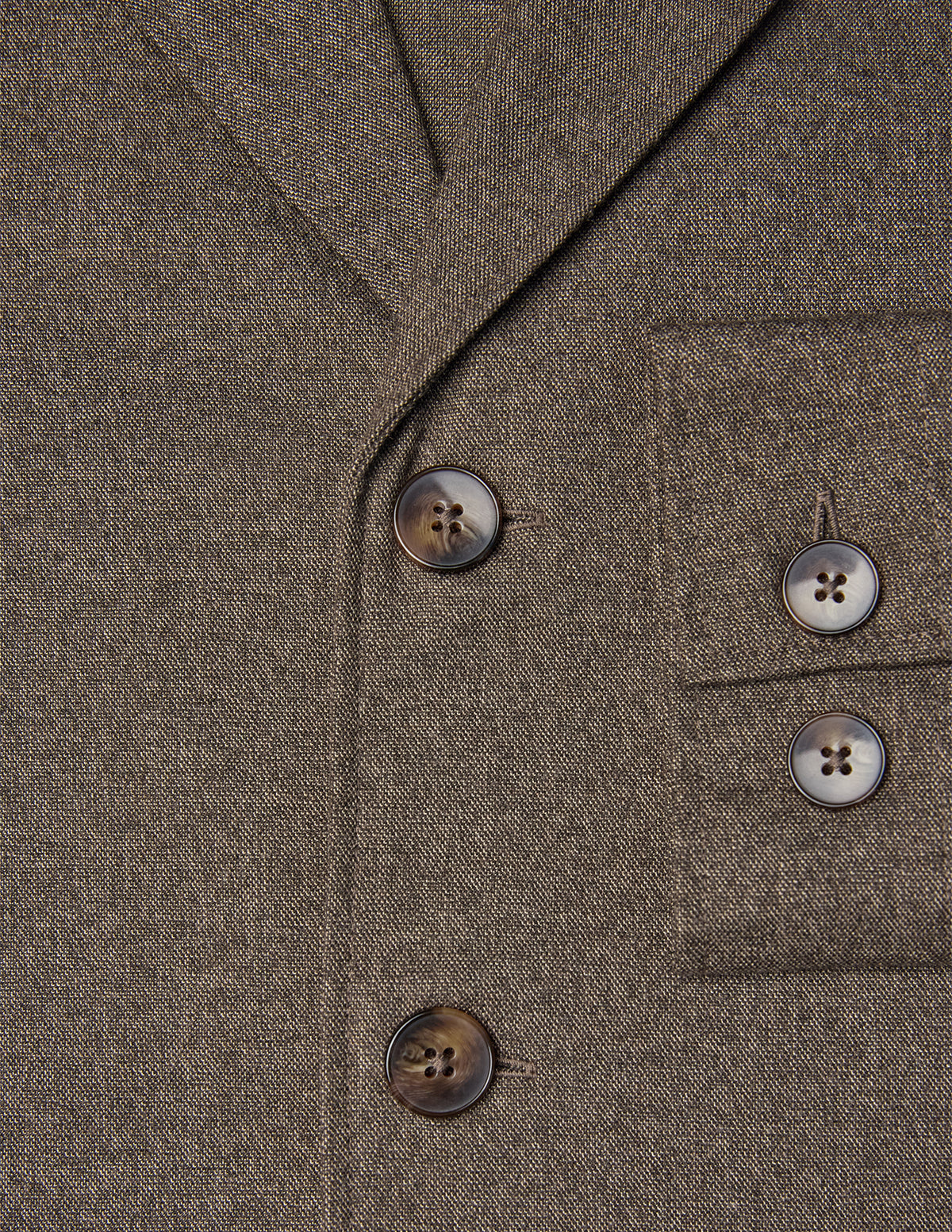 Close-up of an Atelier Overshirt Dark Beige in heavyweight twill, featuring dark horn-style buttons, a breast pocket, and a clean Scandinavian design.