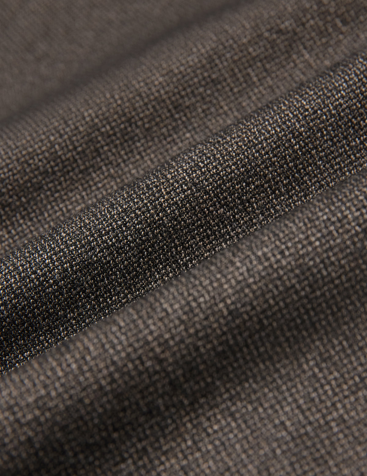 Close-up of the folded dark brown Atelier Overshirt, showcasing a visible, heavyweight woven texture.