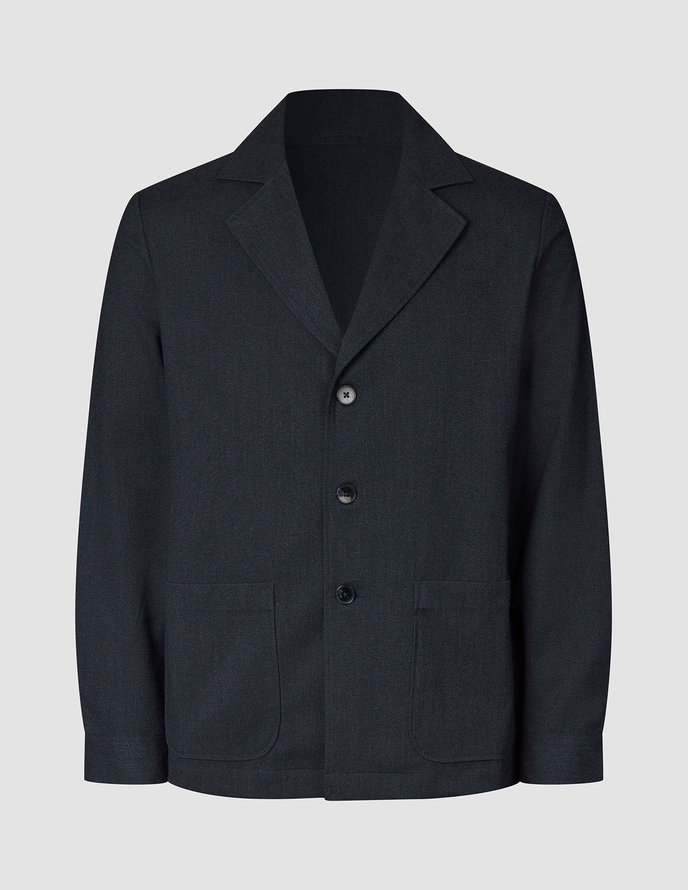 Atelier Overshirt in dark navy featuring a notched collar, two front patch pockets, and a heavyweight textured finish.