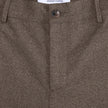 Close-up of the button fly and waistband on Atelier Pants Relaxed Dark Beige in heavyweight broken twill, featuring an internal brand label and minimalist Scandinavian design.