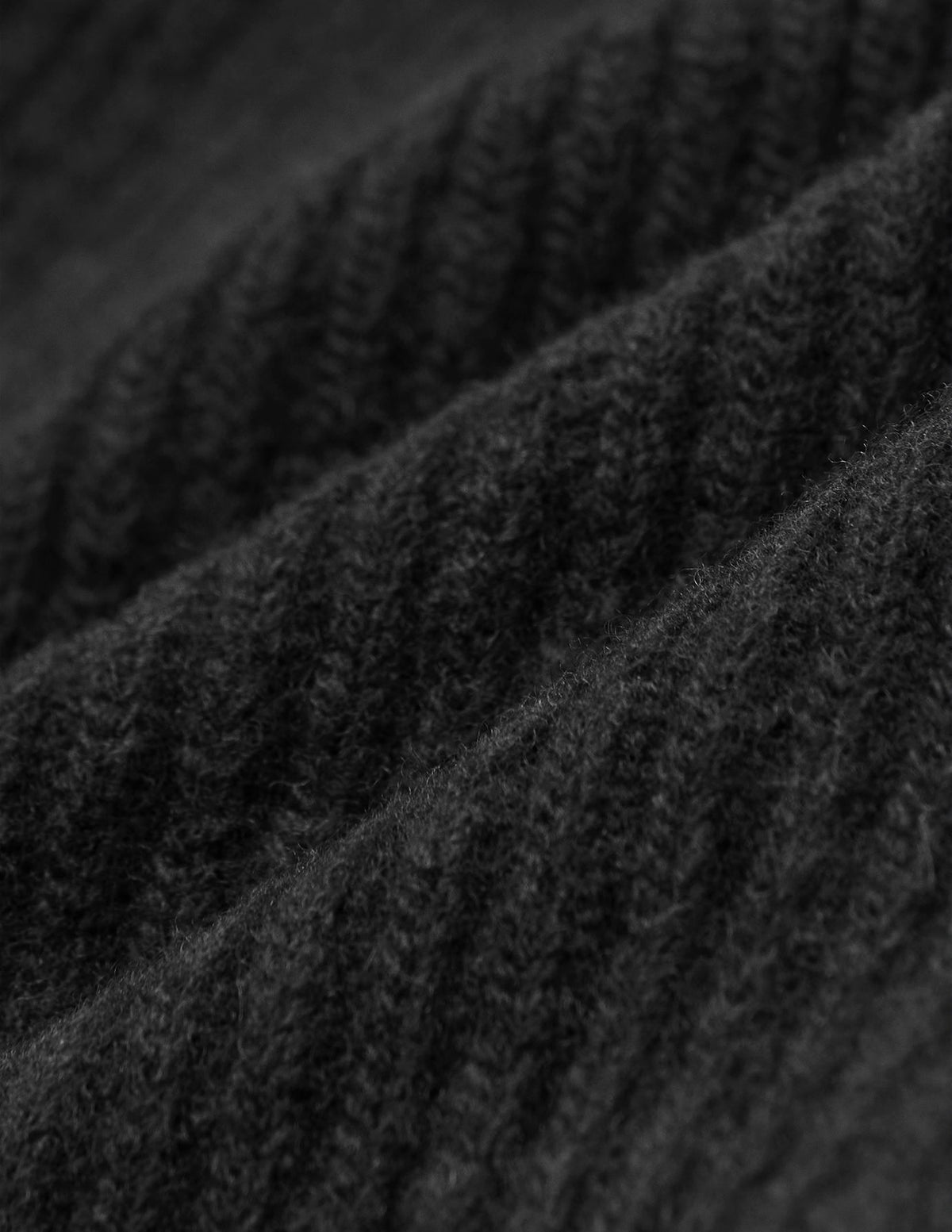 Close-up of a black rib knit Beanie Black.