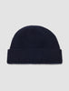 Wool Beanie Navy navy blue merino wool ribbed-knit beanie with a folded cuff.