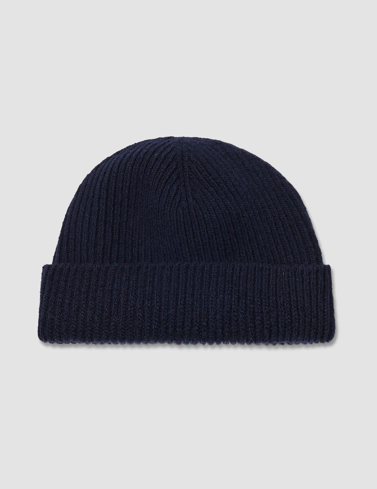 Wool Beanie Navy navy blue merino wool ribbed-knit beanie with a folded cuff.