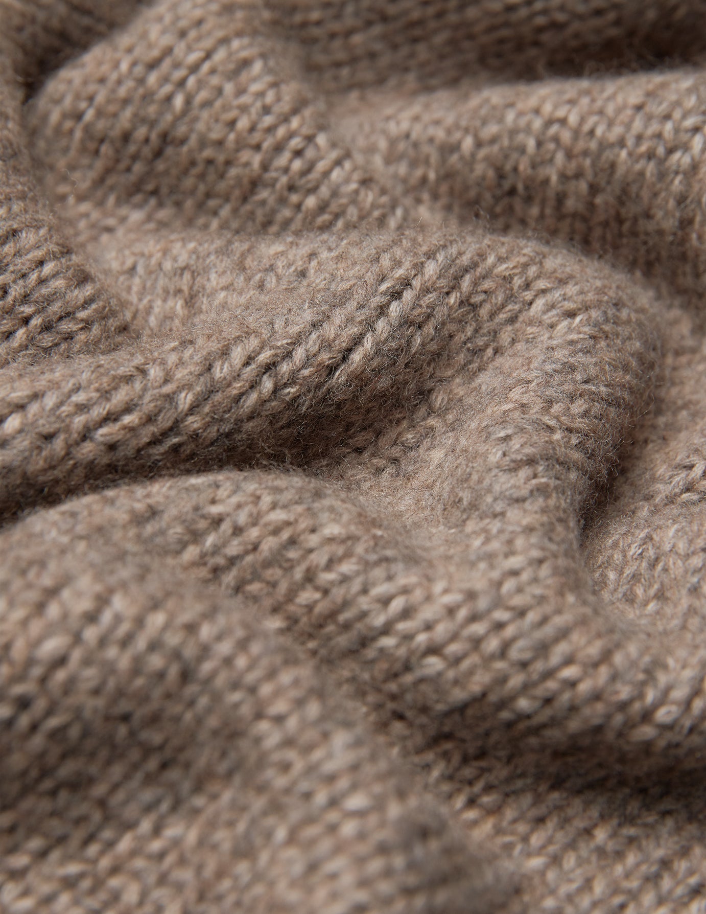 Close-up of a Women’s Chunky Soft Wool Knit Cardigan Taupe Melange, featuring a chunky knit with a visible ribbed texture.