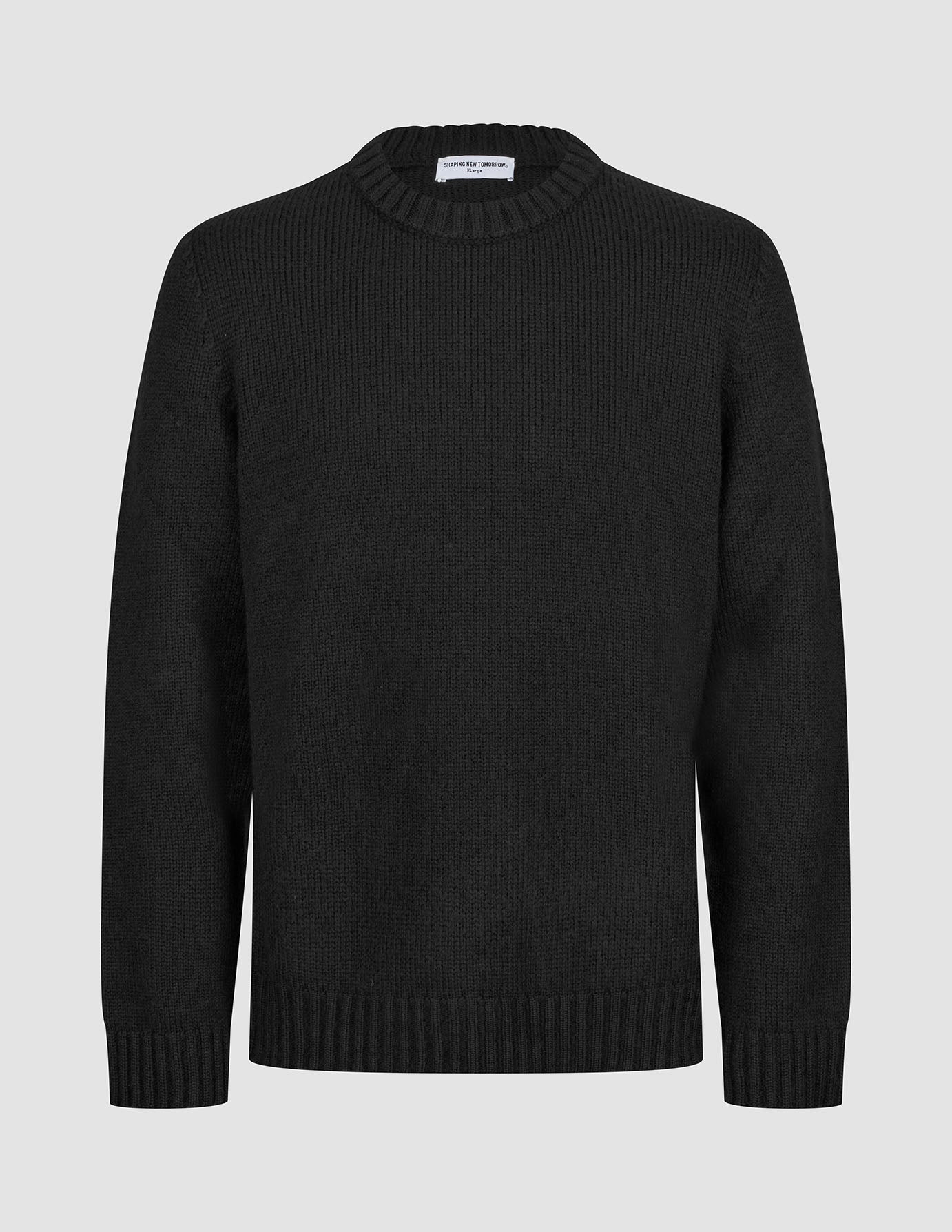 Chunky Soft Wool Knit Crewneck Black sweater featuring a minimalist Scandinavian aesthetic with a ribbed crew neckline, cuffs, and hem.