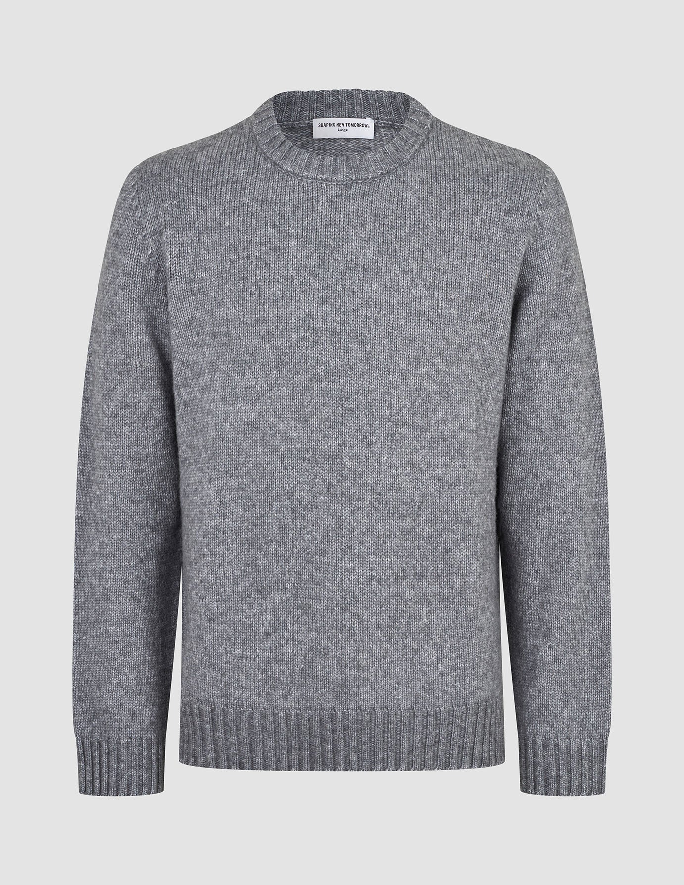 Chunky Soft Wool Knit Crewneck Glacier Grey sweater in a chunky, grey crewneck style with a classic Scandinavian design, ribbed cuffs, and hem.