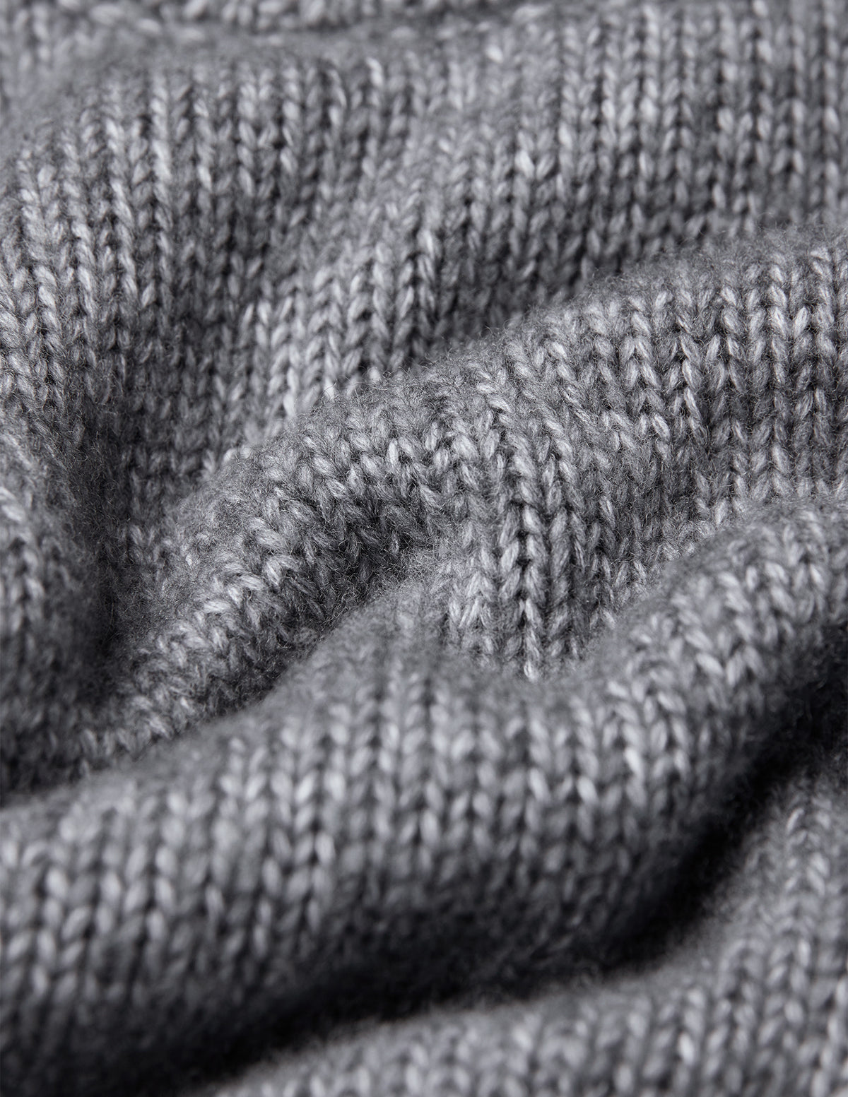 Close-up of a grey Chunky Soft Wool Knit Crewneck Glacier Grey sweater.
