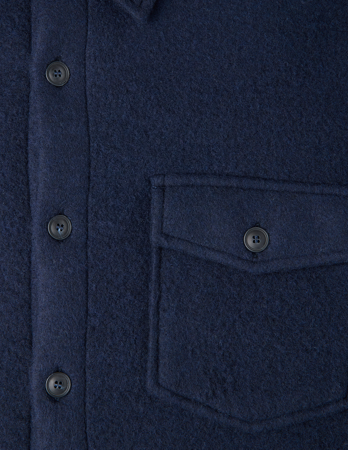 Close-up of a Double Layer Wool Overshirt Regular Dark Navy in a wool blend, featuring a center button placket and a single chest pocket with a buttoned flap.
