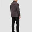 A person seen from behind wearing a Double Layer Wool Overshirt Saddle Brown, black trousers, and black loafers.