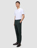 A man wearing an exceptionally soft white crew-neck t-shirt, Ease Pants Slim Northern Pine, and dark leather boots.