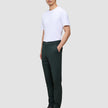 A man wearing an exceptionally soft white crew-neck t-shirt, Ease Pants Slim Northern Pine, and dark leather boots.