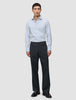 A man wearing an Elevated Shirt Slim Classic Blue Striped light blue button-up shirt with dark trousers and black loafers.