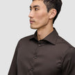 A man wearing an Elevated Shirt Slim Dark Brown button-up shirt.