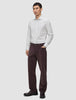A man wearing an Elevated Shirt Slim Light Grey Striped shirt, dark brown trousers, and dark loafers.