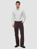 A man wearing an Elevated Shirt Slim Light Grey Striped tucked into dark brown pants and black loafers.