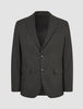 The Motion Blazer Slim Pepper Grey is a tailored, two-button, charcoal grey blazer in lightweight, breathable fabric with notched lapels, two flap pockets, and a chest pocket.