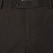 Close-up of Motion Suit Pants Regular Cognac, featuring lightweight, breathable brown fabric with a center button closure and a brand label at the waistband.