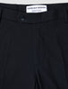 Close-up of the waistband and top of Motion Suit Pants Regular Midnight Blue, featuring a button closure and internal brand label on 360° stretch dark blue fabric.
