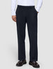 A person wearing a white button-down shirt tucked into Motion Suit Pants Relaxed Midnight Blue and brown leather loafers.