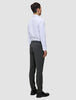 A man viewed from the back wearing a white button-down shirt and Motion Suit Pants Slim Pepper Grey with 360° stretch.