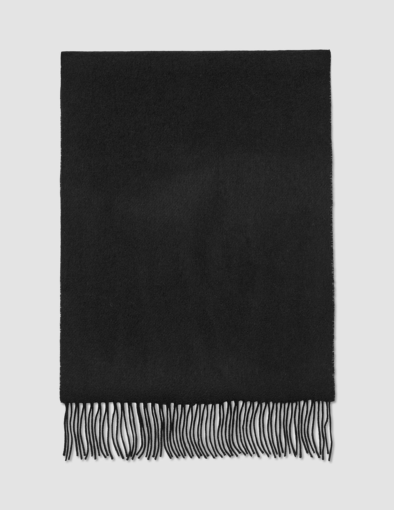 Scarf Black, a black wool scarf with fringe at the bottom edge.