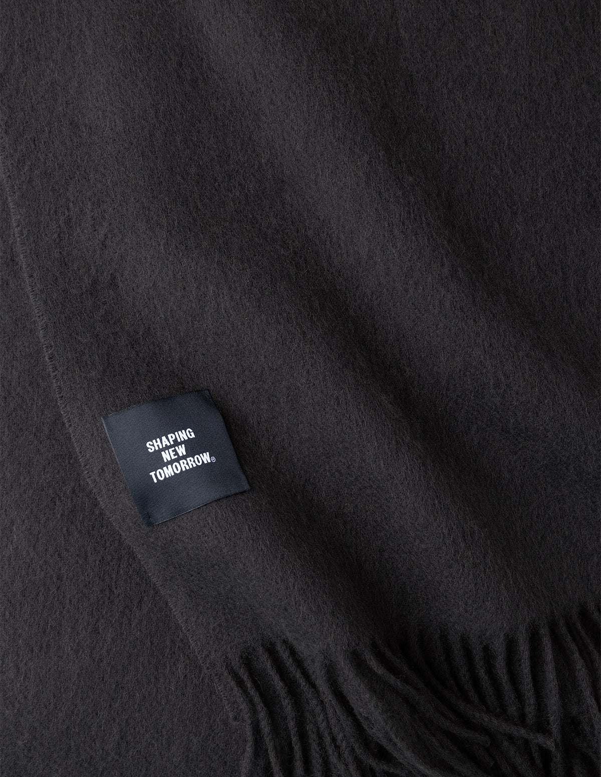 Charcoal grey Scarf Charcoal Grey featuring a fringed edge and a SHAPING NEW TOMORROW fabric label.