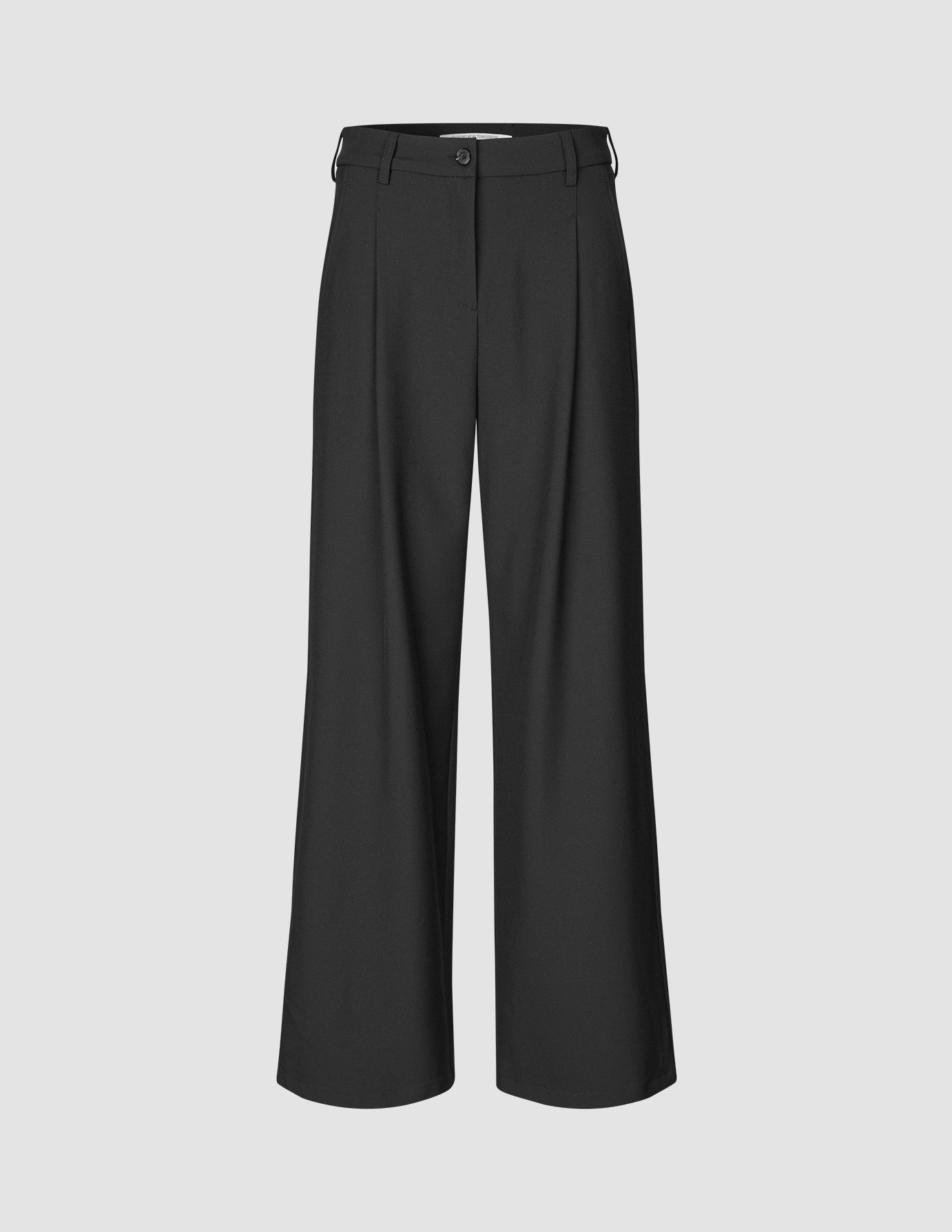 Serene Pants Wide Black in a clean Scandinavian design featuring a high waist, wide legs, front pleats, a button closure, and a zip fly.
