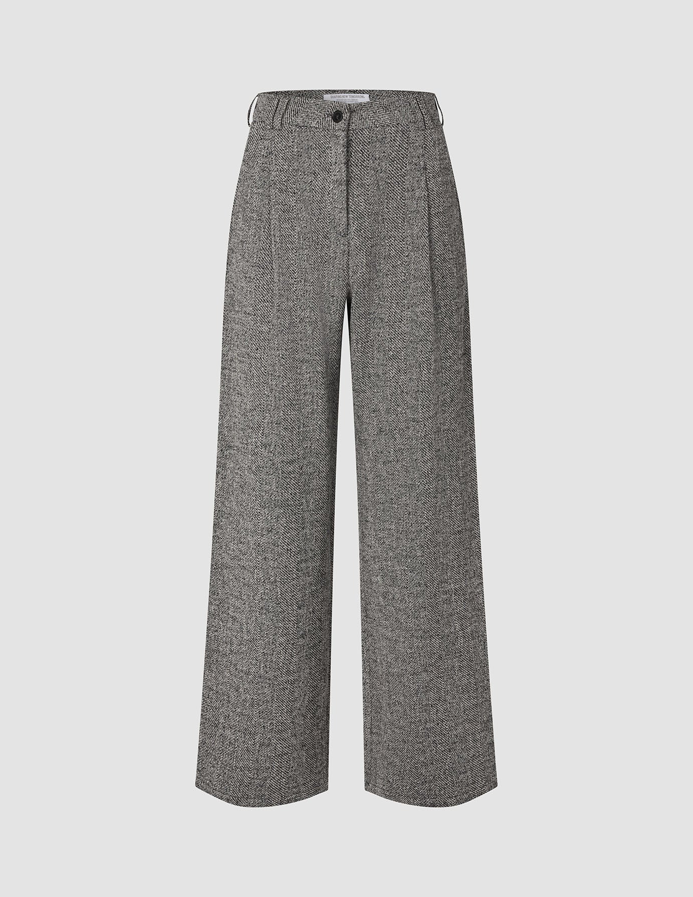 Women Ashryn Pants Wide Domino Herringbone: high-waisted wide-leg trousers in a black and white herringbone bouclé, featuring a button closure and front pleats in a classic Scandinavian design.